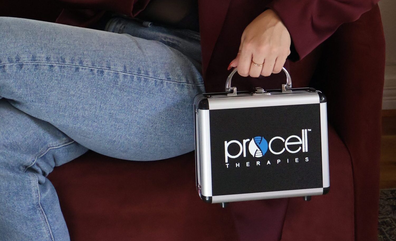 Skincare professional holding Procell Therapies microchanneling equipment case at Arch and Skin Dallas